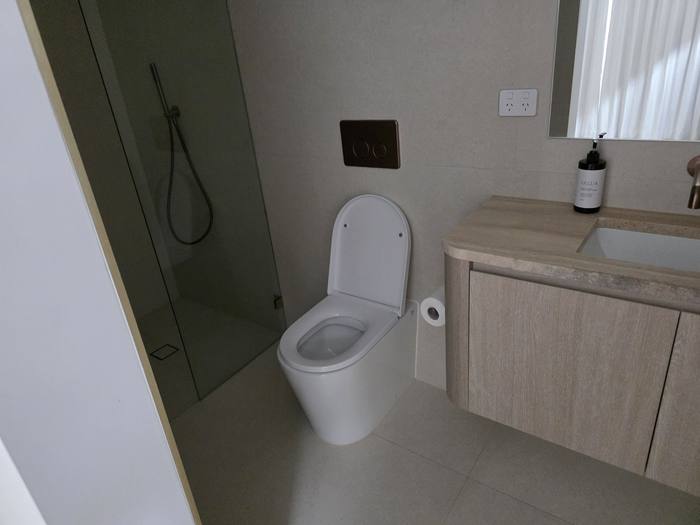 Bathroom renovation with floating vanity and freestanding shower